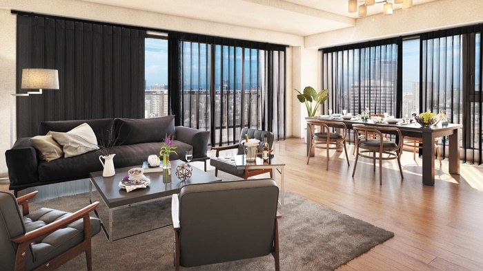 Black sheer vertical drapes in a bright living and dining room