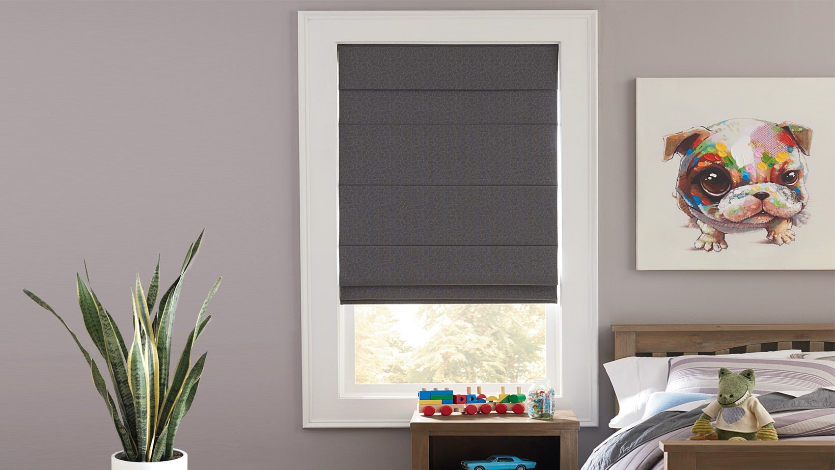 Gray roman shade in a child’s bedroom