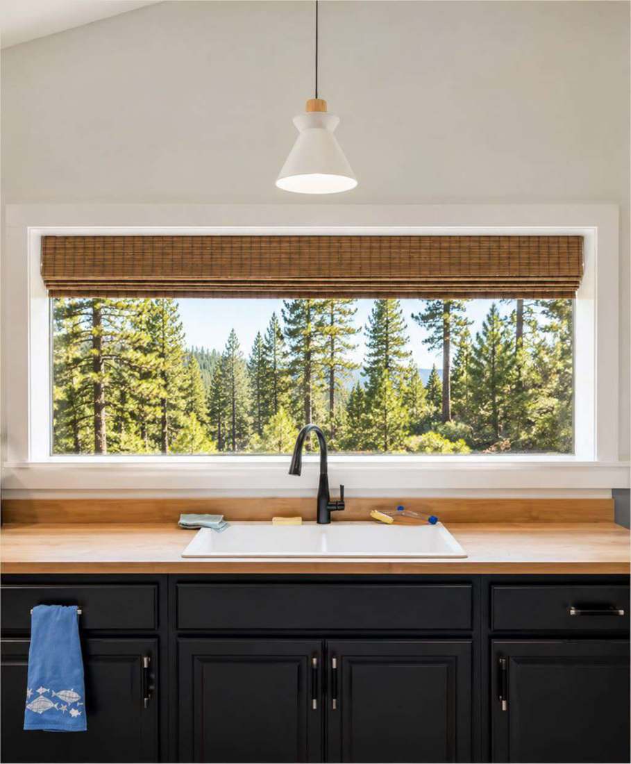 Woven wood shade above a kitchen sink