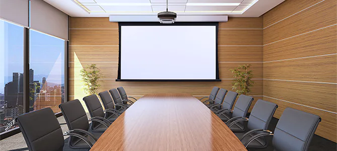 Draper motorized projection screen in a conference room